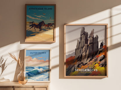 Framed artwork showcasing Seneca Rocks, Outer Banks, and Assateague Island is displayed on a sunlit wall. A vase with dried plants is on a wooden surface below.