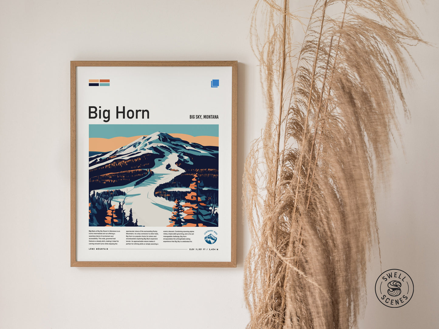 Framed poster of Big Horn ski run in Big Sky, Montana, featuring a stylized mountain landscape with a snow-covered trail. Decorative dried grasses are visible beside the poster.