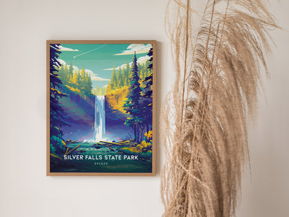 Framed poster of Silver Falls State Park featuring a vibrant waterfall surrounded by lush green and yellow trees, with pampas grass decoratively placed beside it.
