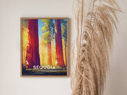 Sequoia National Park poster features towering red trees with sunlight filtering through, framed on a wall beside dried pampas grass. The words Sequoia National Park, California are visible.