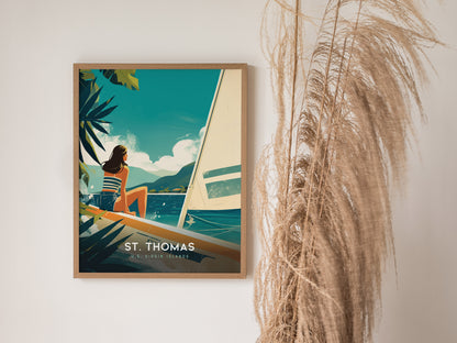 A framed poster of St. Thomas, U.S. Virgin Islands, features a woman on a boat overlooking turquoise waters and sailboats, with lush greenery and mountains in the background.