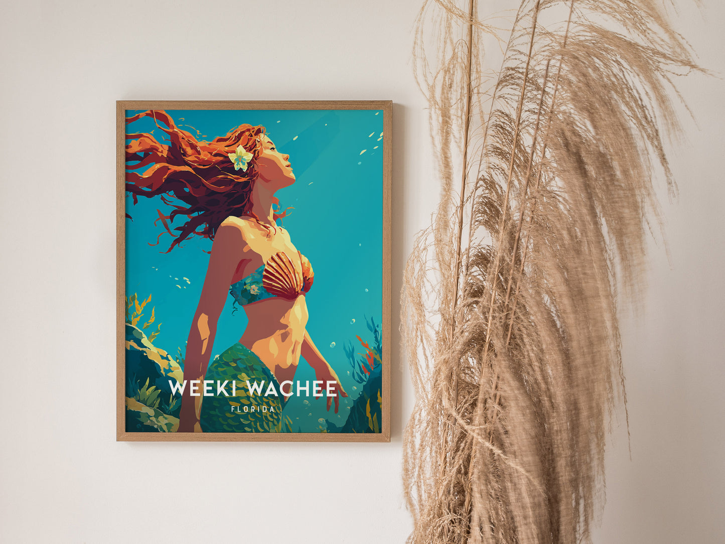 A vibrant poster featuring a mermaid with flowing red hair, adorned with a seashell bra, set against a bright blue background.