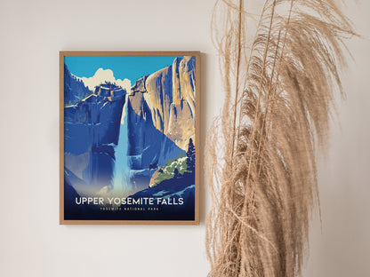 A framed poster of Upper Yosemite Falls hangs on a white wall, depicting the waterfall cascading down granite cliffs. Tall dried grasses stand beside the frame.