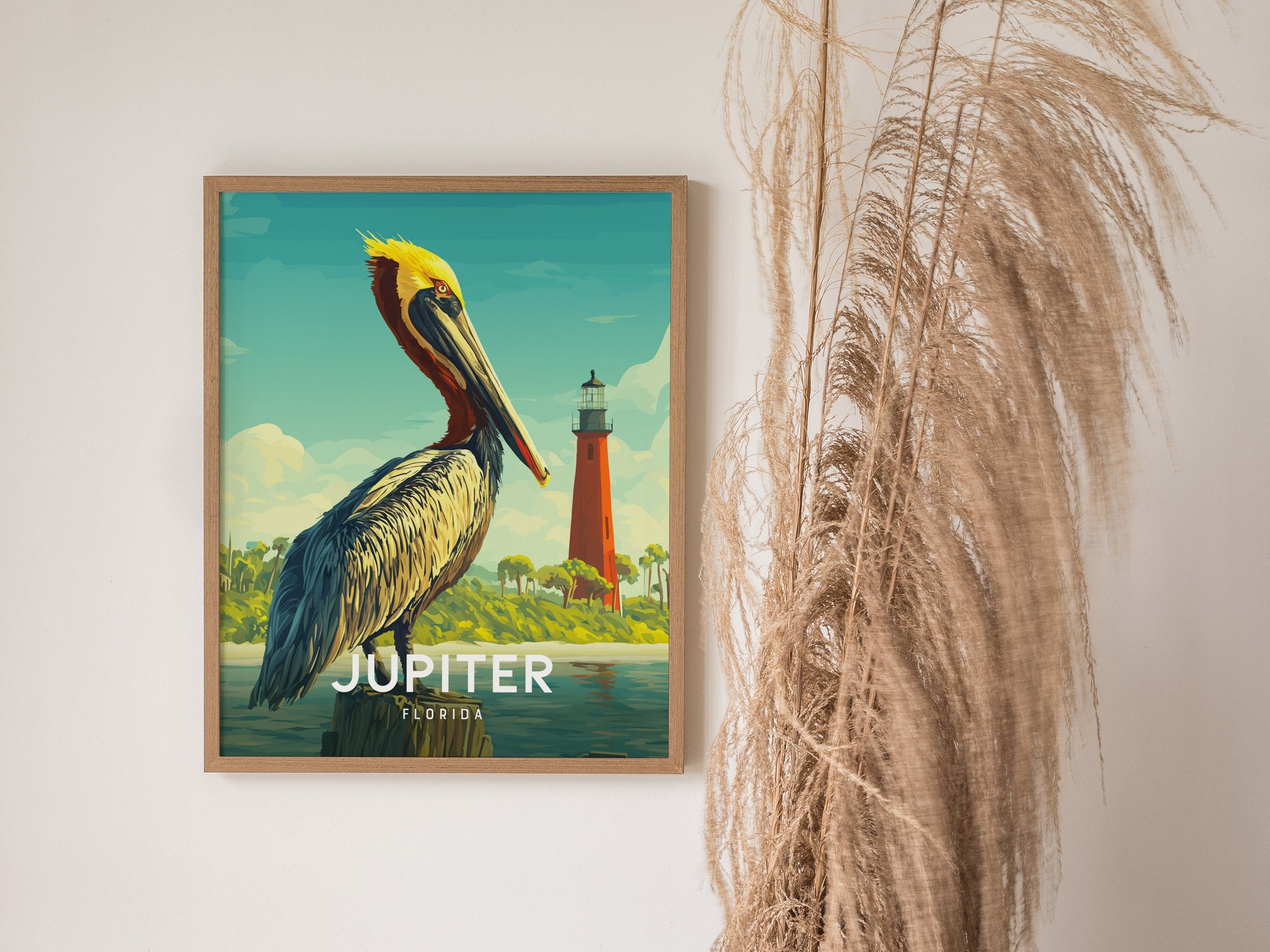 Framed artwork of a pelican with a lighthouse in the background, labeled 'Jupiter, Florida'.