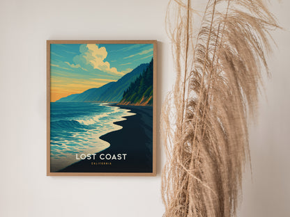 Framed Lost Coast California poster showcases a vibrant ocean scene with crashing waves, forested hills, and a warm sunset sky.