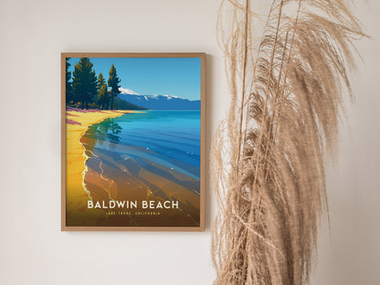 A framed poster of Baldwin Beach, Lake Tahoe, displays a vibrant illustration of a sandy shore, clear blue waters, and pine trees. It hangs beside tall, wispy dried grasses.