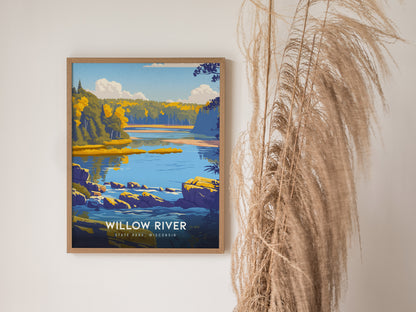 A framed art print depicting a serene landscape of Willow River State Park in Wisconsin, showcasing vibrant blue waters, lush green trees, and rocky shores under a bright sky.