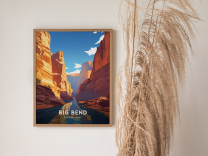 A framed poster of Big Bend National Park hangs on a white wall, featuring vibrant canyon landscapes and a clear blue sky, with dried pampas grass nearby for decoration.