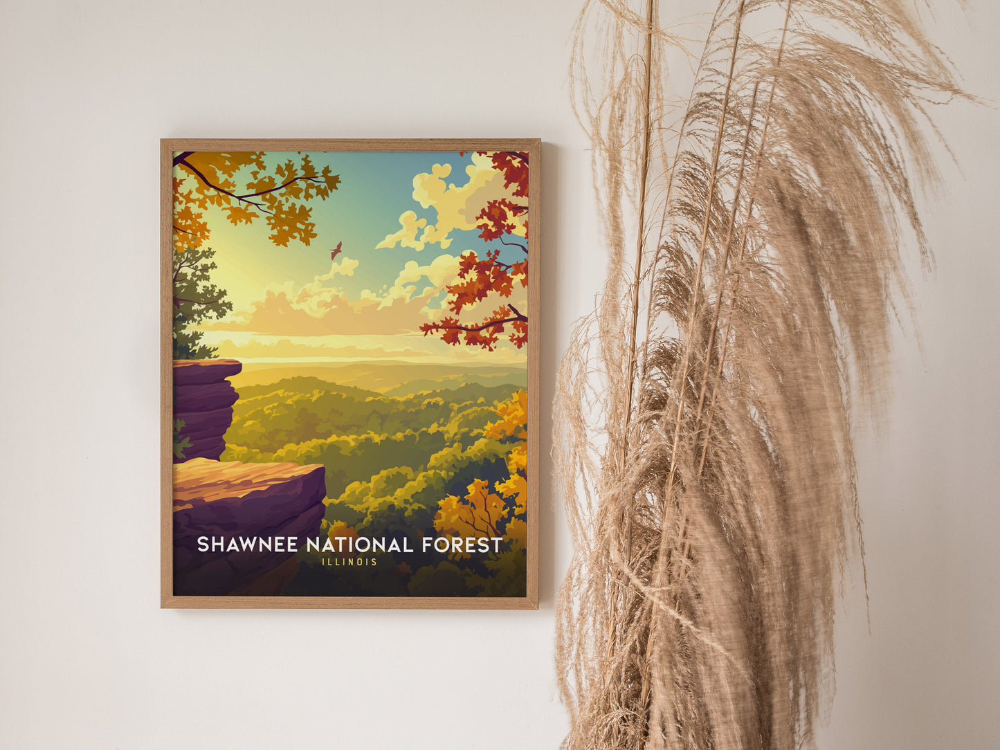 Framed Shawnee National Forest poster featuring autumn foliage in vibrant orange and yellow, with a cliff edge and serene sky.