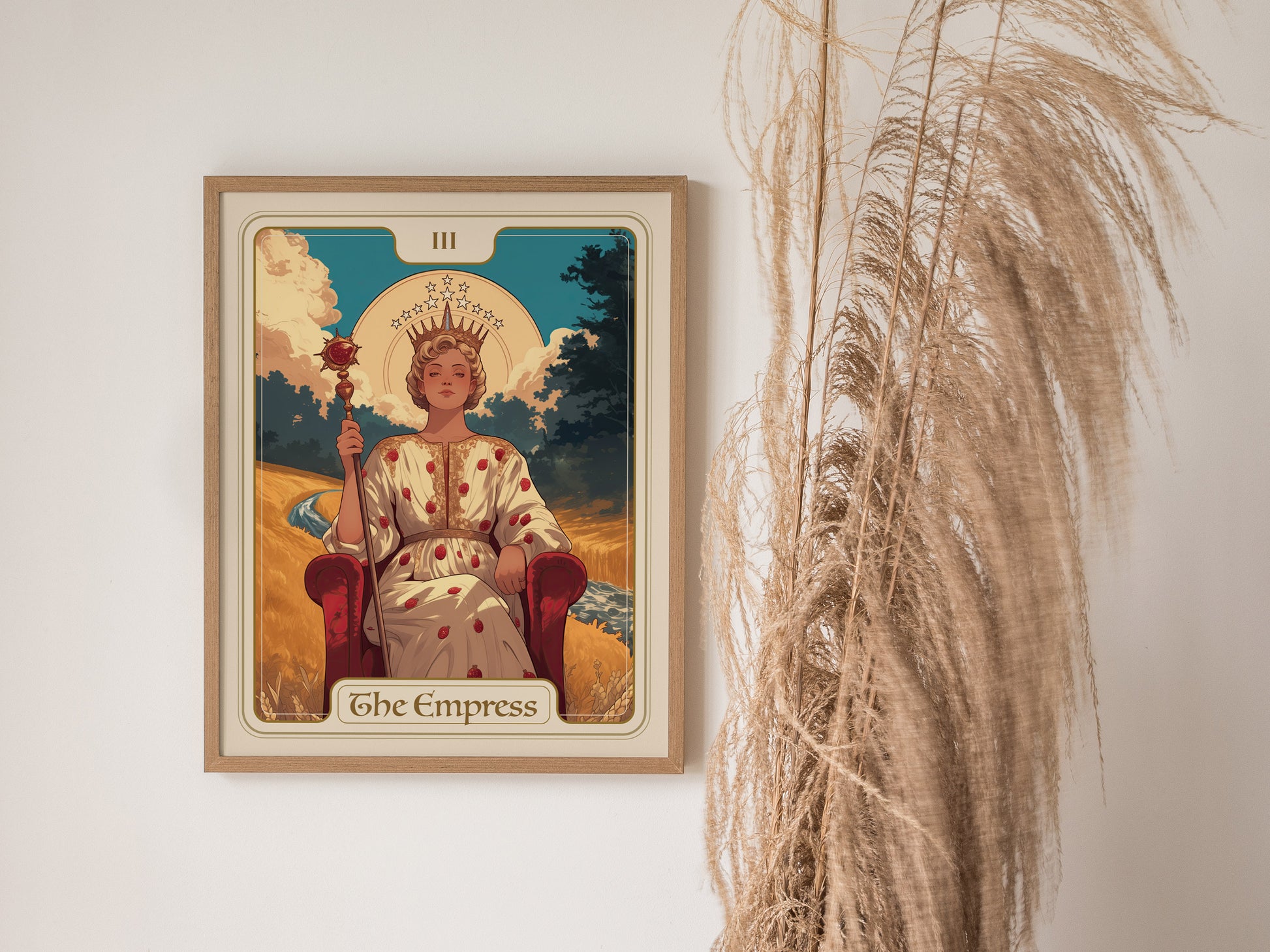 The image shows an Empress Tarot card poster framed on a wall, depicting a crowned woman seated on a throne with a scepter, accompanied by pampas grass.