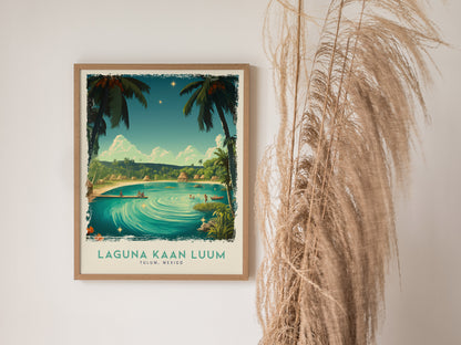 A framed poster of Laguna Kaan Luum features a turquoise lagoon surrounded by palm trees under a clear sky, with decorative pampas grass beside it.