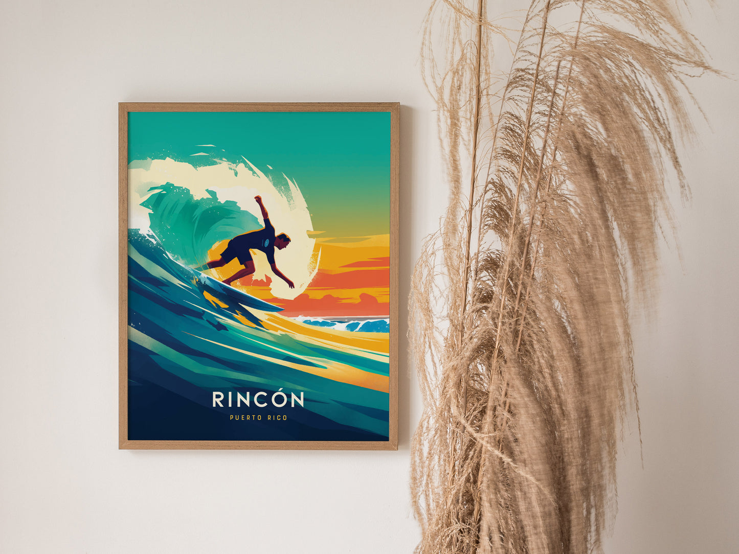 A framed poster features a surfer riding a vibrant wave against a colorful sunset background, with the text Rincon Puerto Rico below. Pampas grass decorates the right side.