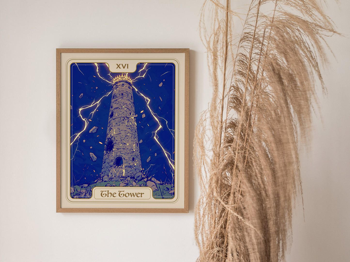 A framed poster of The Tower Tarot card hangs on a wall, featuring a tall, stone tower struck by lightning against a deep blue background.