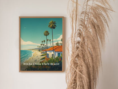 A framed Bolsa Chica State Beach poster hangs on a white wall, depicting a coastal scene with palm trees and a vibrant beach.