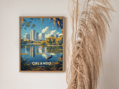 A framed poster of Orlandos Lake Eola skyline features a heron and reflections in the water, with tall pampas grass nearby.