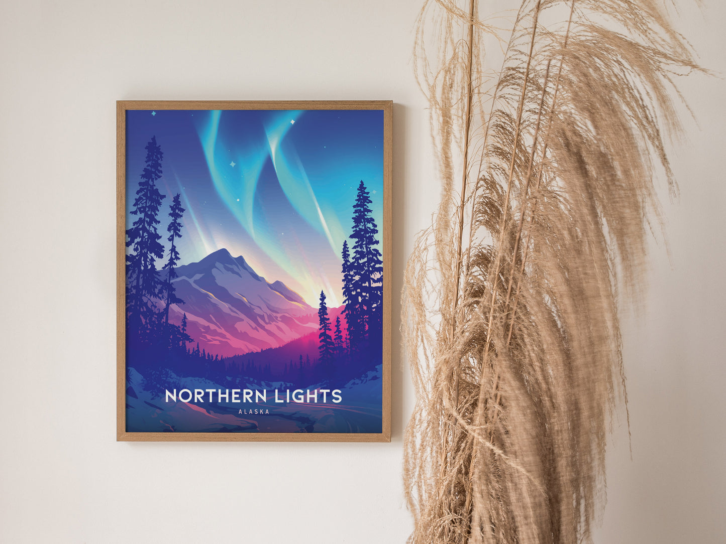 A framed poster of the Northern Lights in Alaska hangs on a wall, depicting vibrant auroras over a mountainous landscape, with dried pampas grass nearby.