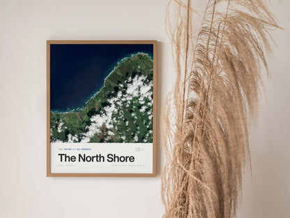 Framed satellite print of Oahu's North Shore, showcasing vibrant blues and greens of coastline, ocean, and clouds in stunning detail.
