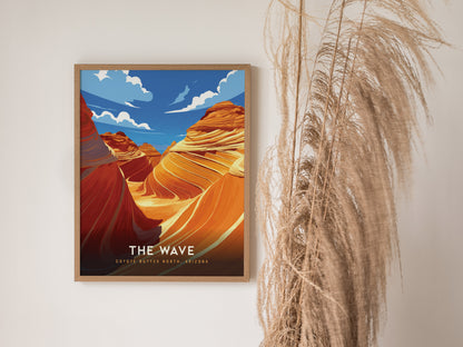 A framed poster of The Wave in Coyote Buttes, Arizona, featuring vibrant swirling sandstone formations against a bright blue sky, is displayed next to tall, wispy dried grass.