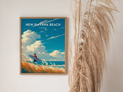 A framed poster of New Smyrna Beach, Florida, shows a surfer holding a surfboard against a backdrop of ocean waves and clouds. Tall grasses are visible beside the artwork.
