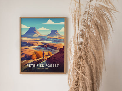 Framed poster of Petrified Forest National Park featuring vivid desert landscape with mesas and a lone figure. Dried pampas grass decorates the wall beside the artwork.