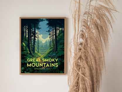 A framed poster depicting the Great Smoky Mountains with a forest path under a cloudy sky, alongside decorative dried grass on a plain wall.