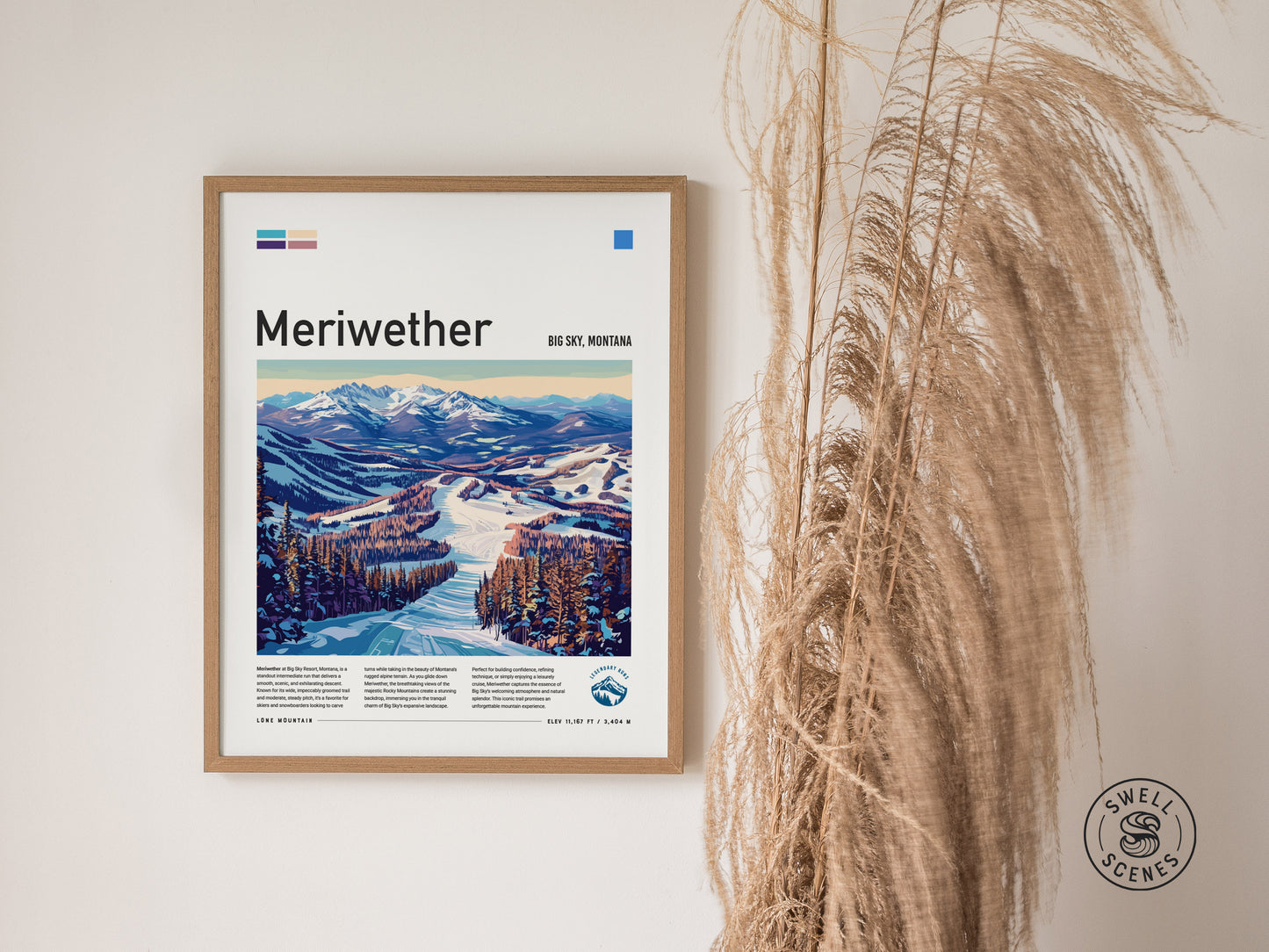 Framed Meriwether Ski Run poster featuring a scenic snowy landscape beneath mountains, hung on a white wall with tall dried grasses beside it. The Swell Scenes logo is visible.