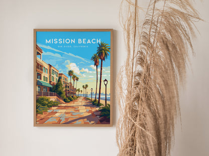 Framed poster of Mission Beach, San Diego, featuring a sunlit boardwalk with palm trees and colorful houses, displayed next to tall, dried grasses against a light wall.