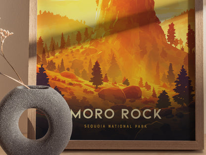 A framed poster of Moro Rock in Sequoia National Park features a vibrant orange landscape with silhouetted trees. A round, textured vase with dried flowers is placed nearby.