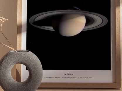Close up of Saturn NASA print highlighting ring structure and atmospheric bands