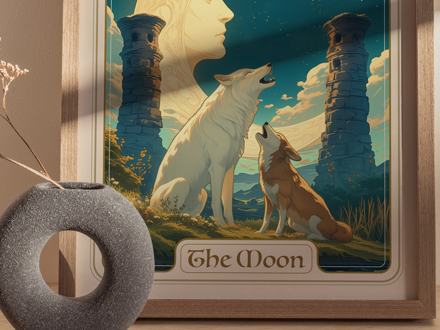 A framed poster titled The Moon depicts a white wolf and a brown dog howling beneath a crescent moon between two ancient pillars, with a vase in the foreground.
