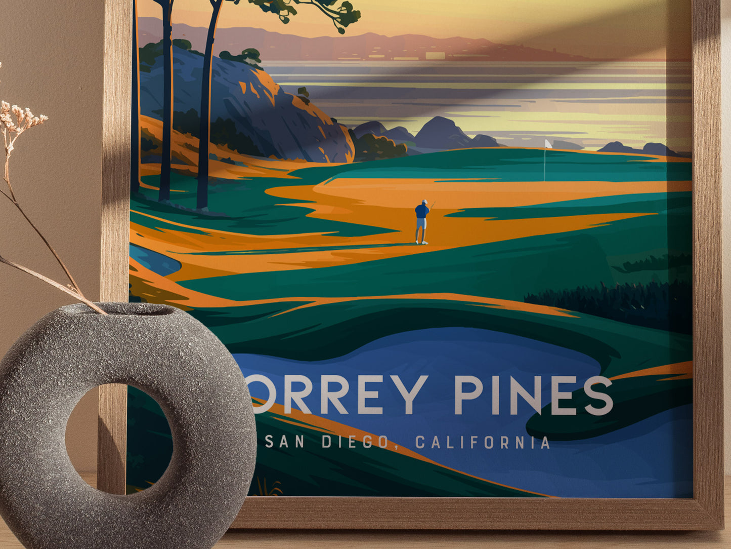 A framed poster of Torrey Pines Golf Course with a golfer on vibrant fairways, dramatic coastal cliffs, and ocean views.