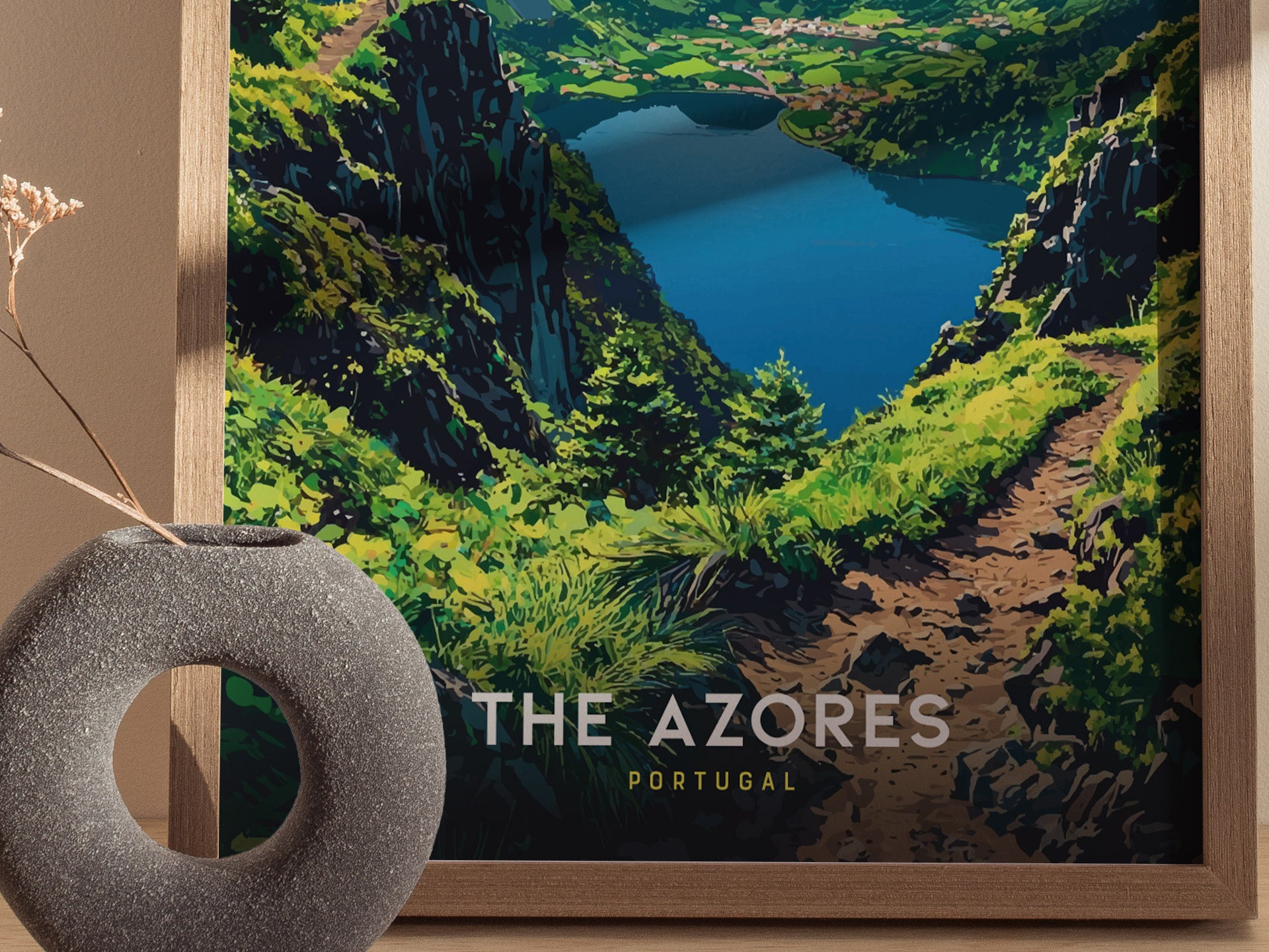 Framed artwork of a mountain landscape with a lake, labeled 'The Azores Portugal'.