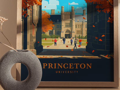 A framed poster featuring an illustration of Princeton University, showing a Gothic-style building, tree-lined walkways, and people walking. Autumn leaves are scattered, adding warmth to the scene.