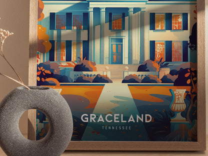 A vibrant poster of Graceland shows a stylized depiction of the mansions façade with bold colors and shadows. A decorative vase with dried flowers sits in the foreground.