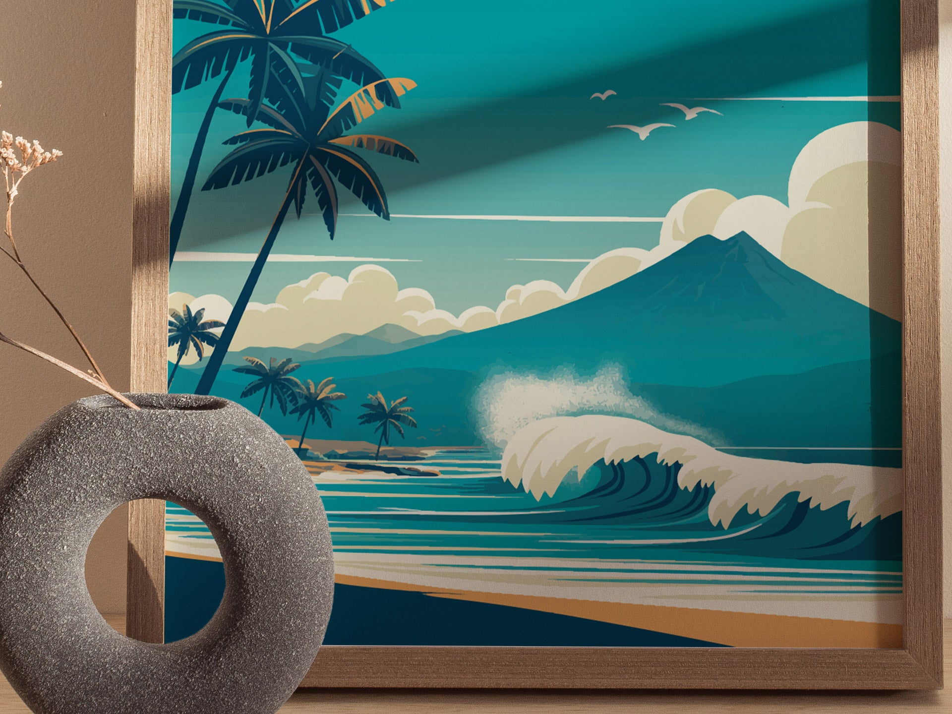 A vibrant poster features a coastal scene with palm trees, crashing waves, a volcanic mountain, and seagulls in the sky, framed by light wood. A textured vase sits nearby.