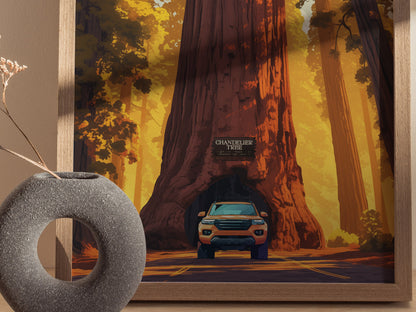 A framed poster depicts a car driving through the base of the Chandelier Tree, surrounded by tall redwoods and warm, golden light. A stone vase sits nearby.
