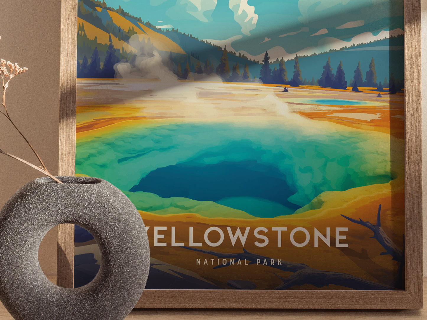 A vibrant poster depicts the Morning Glory Pool in Yellowstone National Park, showcasing its striking blue and green hues. A textured circular vase sits in the foreground.
