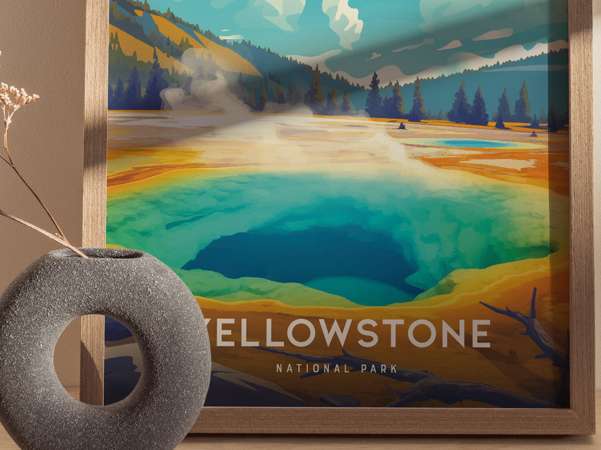A vibrant poster depicts the Morning Glory Pool in Yellowstone National Park, showcasing its striking blue and green hues. A textured circular vase sits in the foreground.