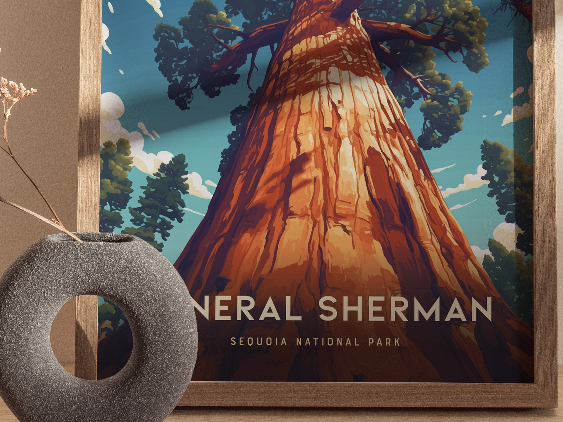 A framed poster of the General Sherman Tree in Sequoia National Park, viewed from below, with sunlight highlighting the trees massive trunk. A textured vase is visible beside it.