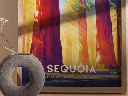 Framed Sequoia National Park poster featuring vibrant illustrations of towering sequoia trees with sunlight filtering through. A round, textured gray vase with dried flowers sits in the foreground.