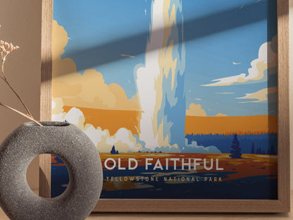 A framed poster of Old Faithful geyser erupting against a vibrant blue and orange sky. A round stone vase with dried flowers is positioned in the foreground.