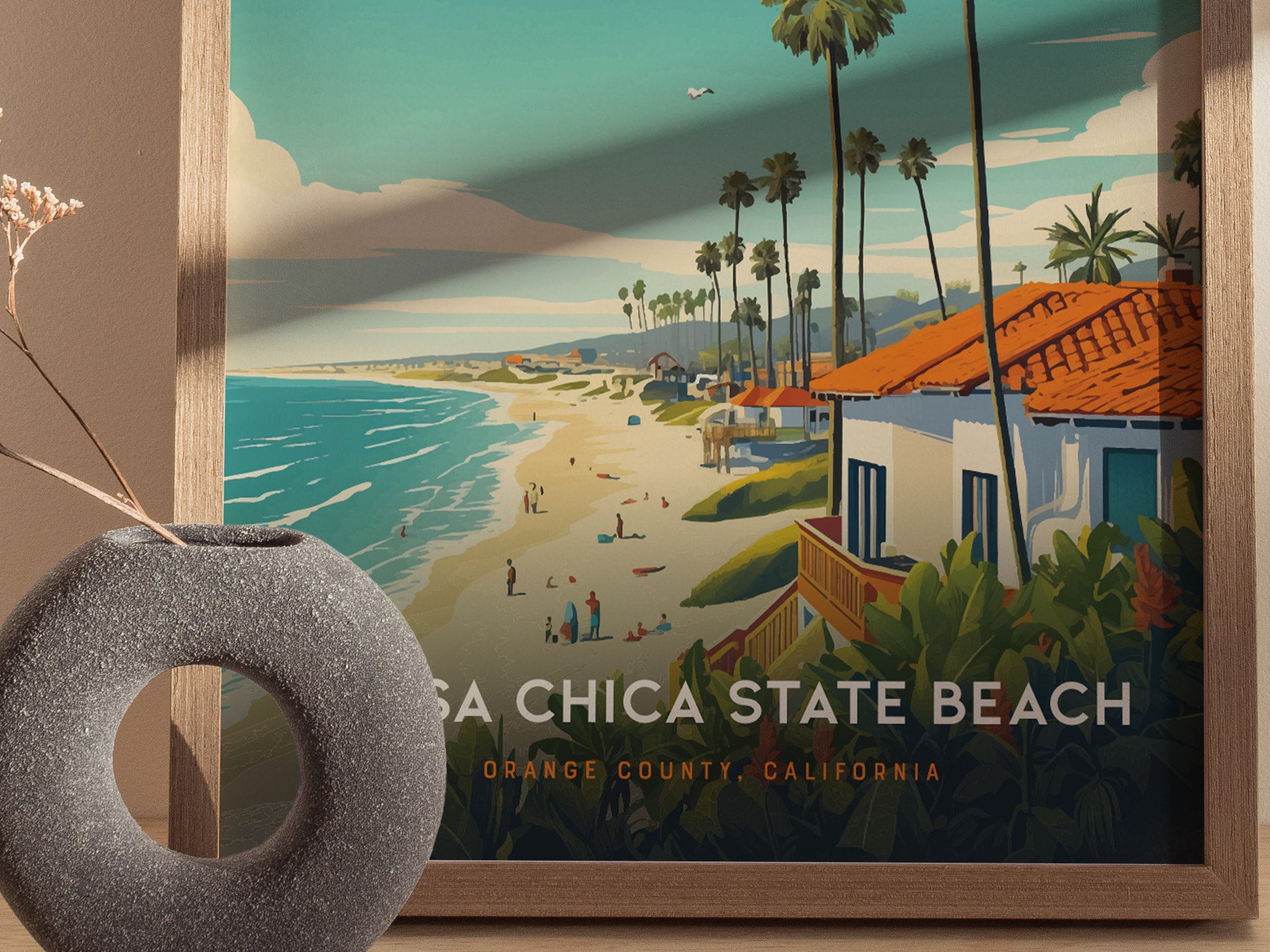 A vintage-style poster of Bolsa Chica State Beach featuring golden sands, ocean waves, and palm trees, framed with a ceramic vase in the foreground. Text reads Orange County, California.