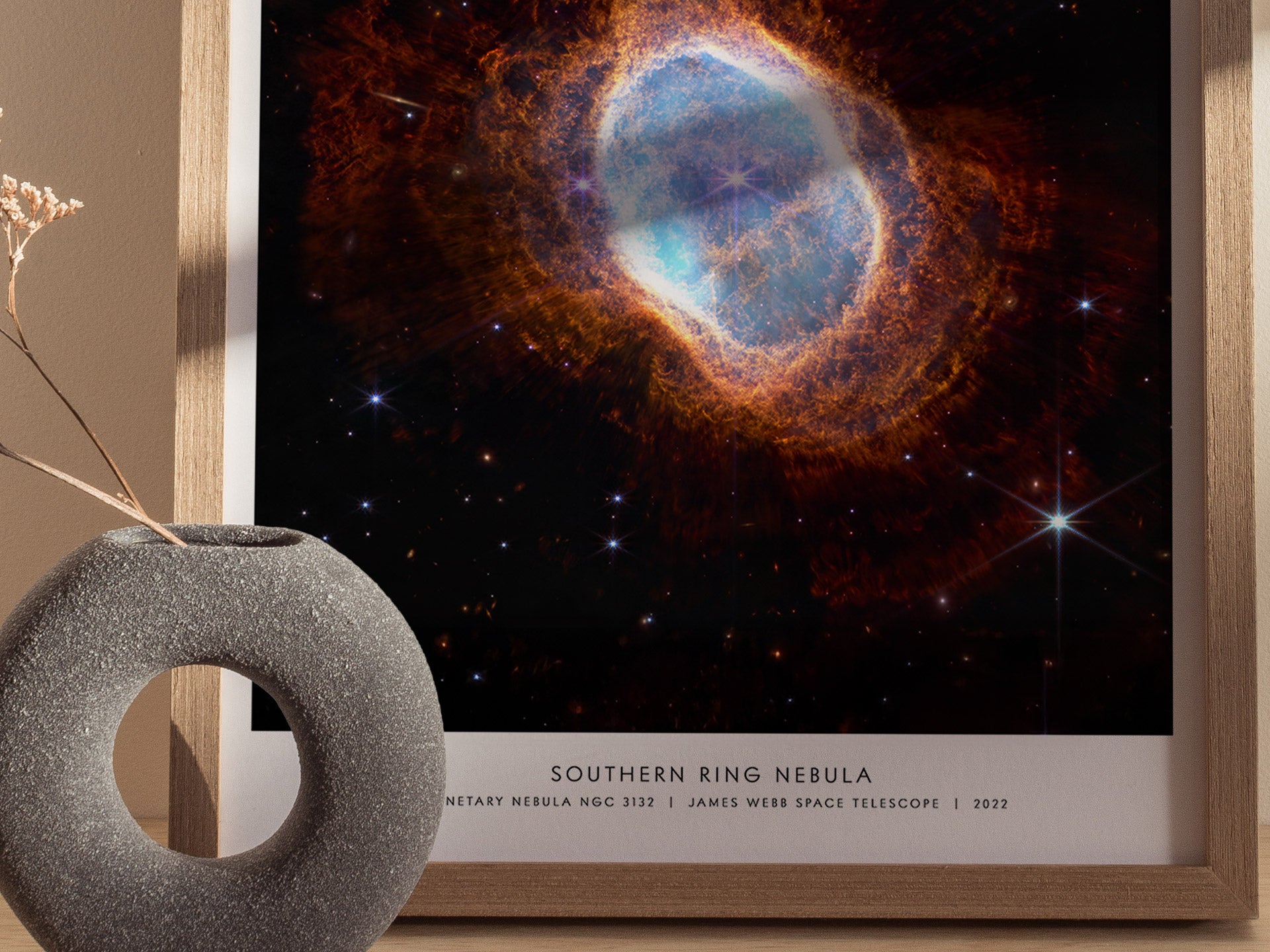 Close up of Southern Ring Nebula poster showing layered gas shells and twin central stars