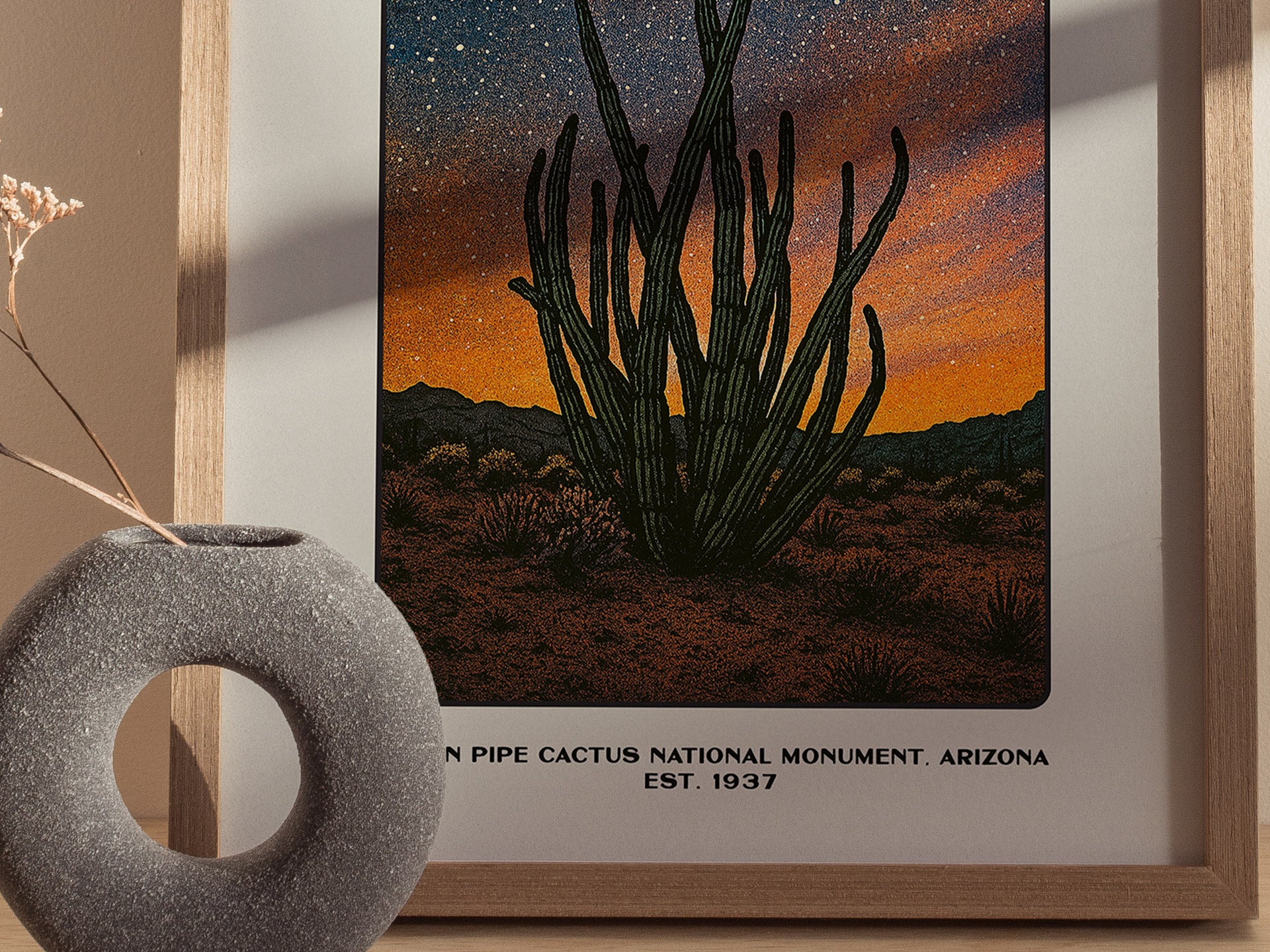 Close up of Organ Pipe Cactus poster showing tall cactus stems silhouetted against a sunset sky