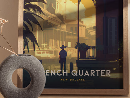A framed poster of the French Quarter in New Orleans shows a person standing on a vibrant street with classic architecture. A decorative vase is placed nearby.