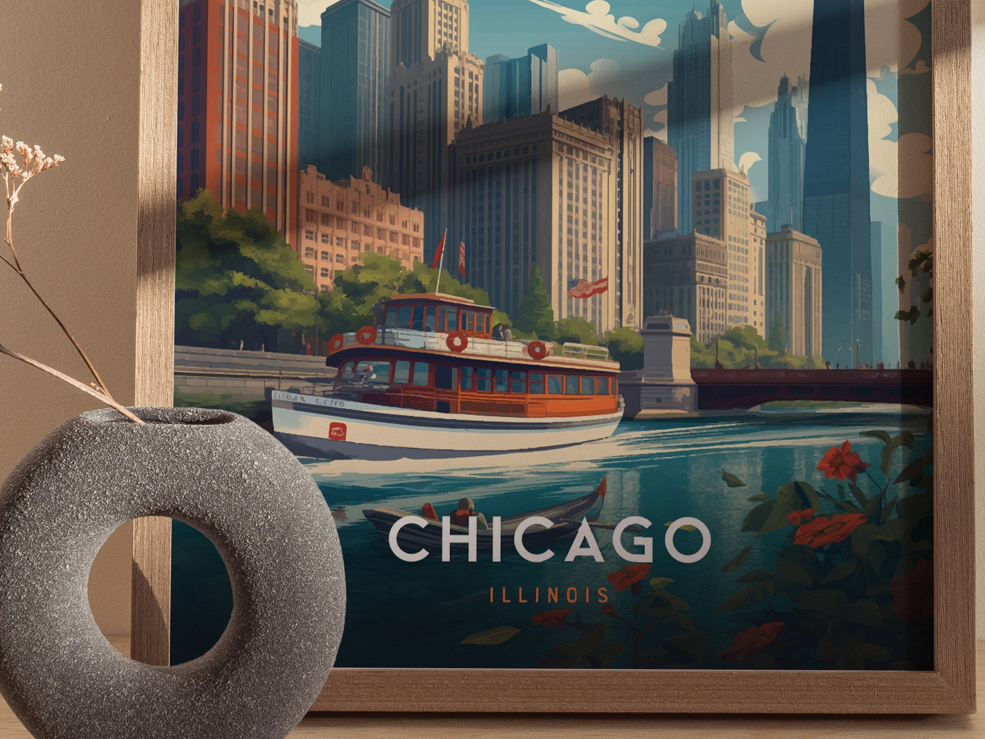 A framed poster depicts Chicagos riverfront, featuring a vintage boat on the water and a skyline of tall buildings. A gray circular vase with dried flowers is in the foreground.