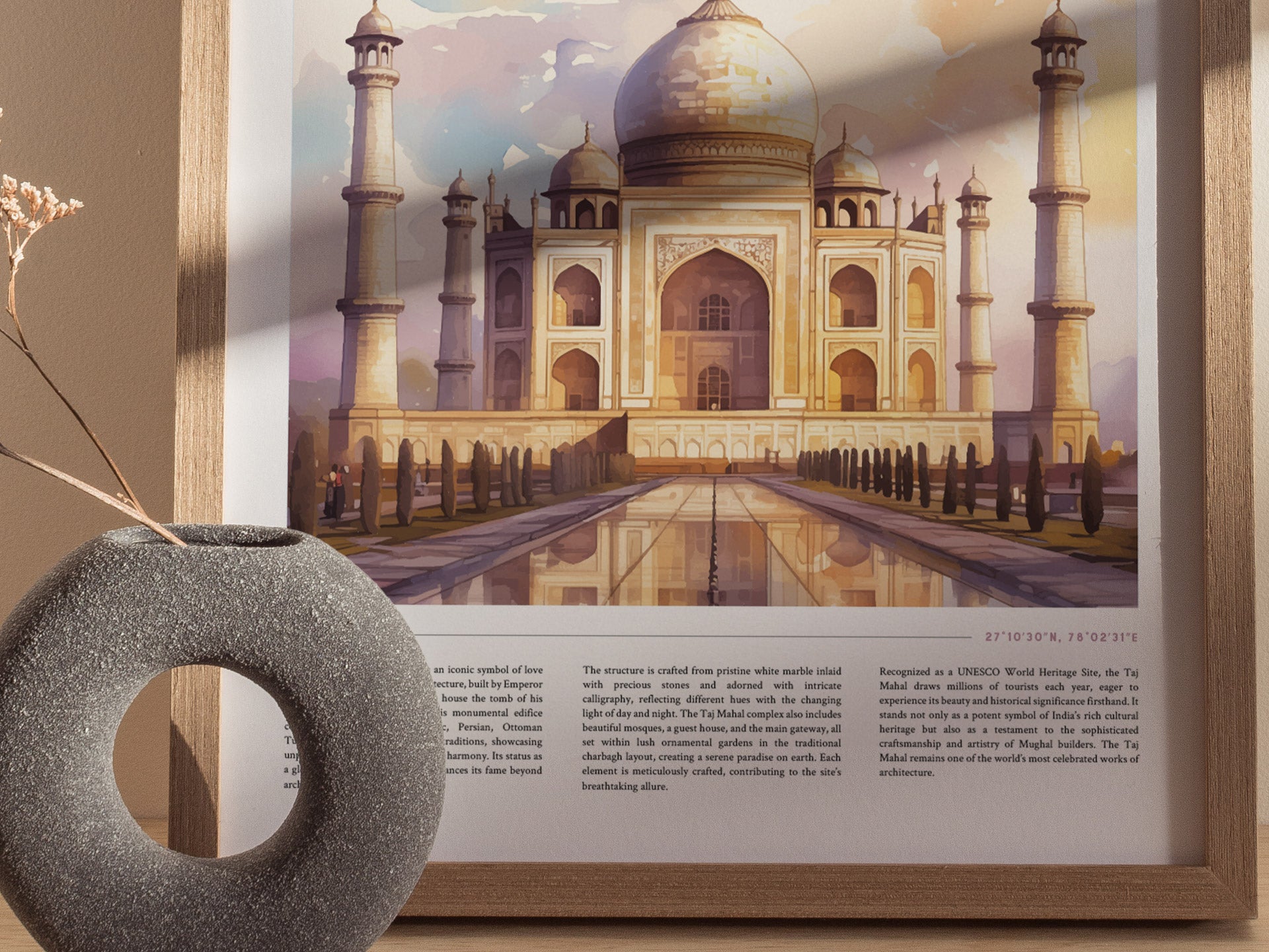 A framed poster of the Taj Mahal in watercolor style is displayed beside a textured circular vase. The artwork captures the monuments intricate architecture and serene reflection.