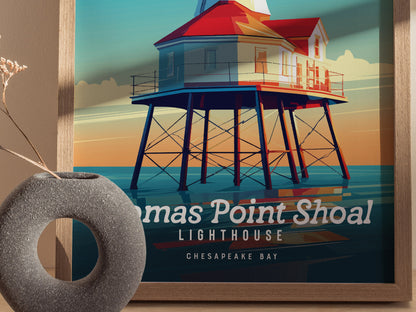 A colorful poster of Thomas Point Shoal Lighthouse on the Chesapeake Bay is framed on the wall, with a round gray vase in the foreground.