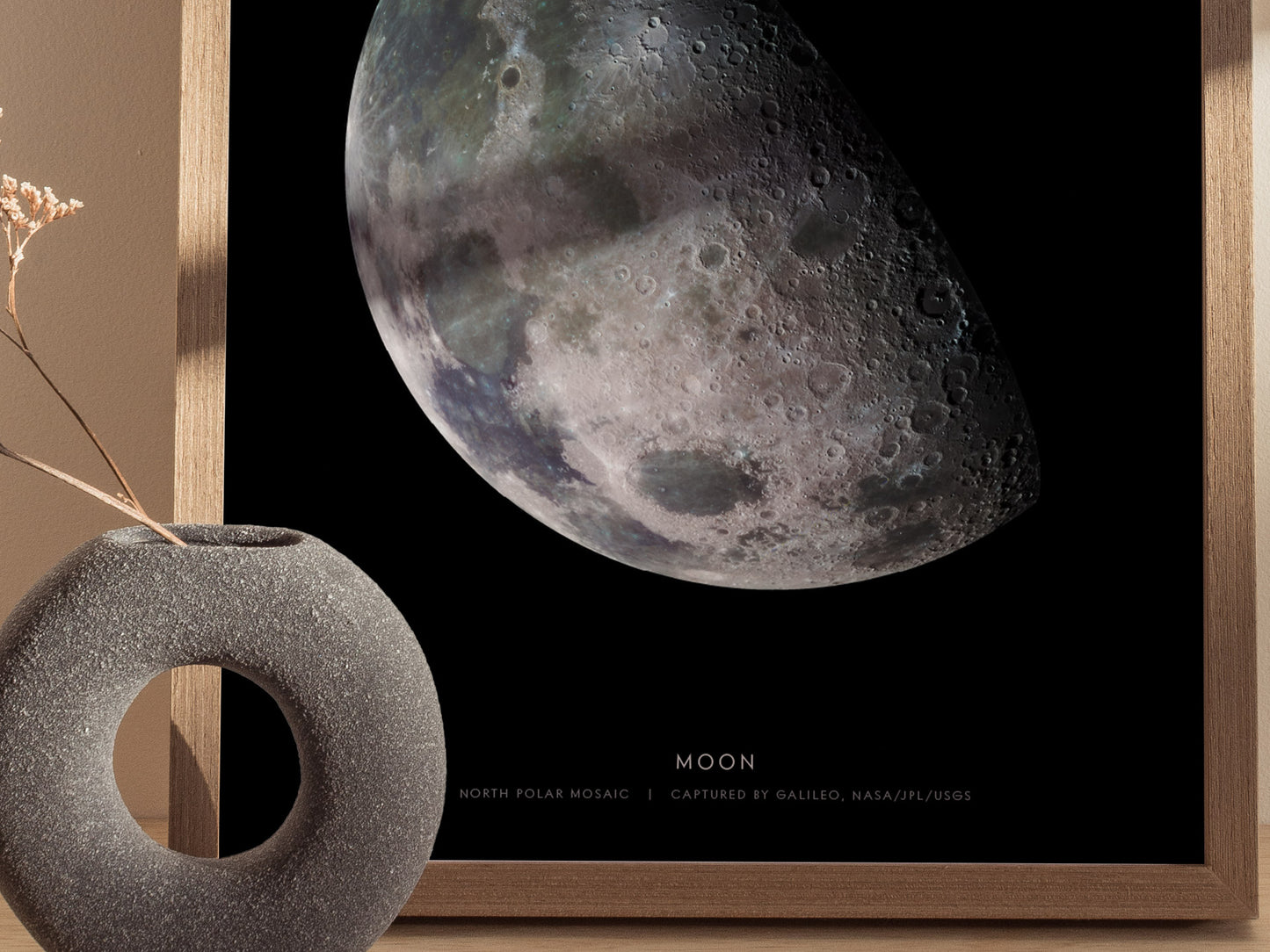 Close up of Moon poster highlighting craters, shadows, and subtle lunar surface textures
