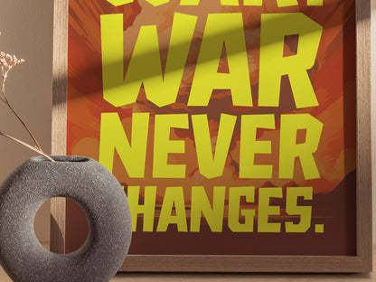 A framed poster with bold yellow text reading WAR NEVER CHANGES against a background of muted reds and oranges. A textured, circular gray vase with dried flowers is in the.
